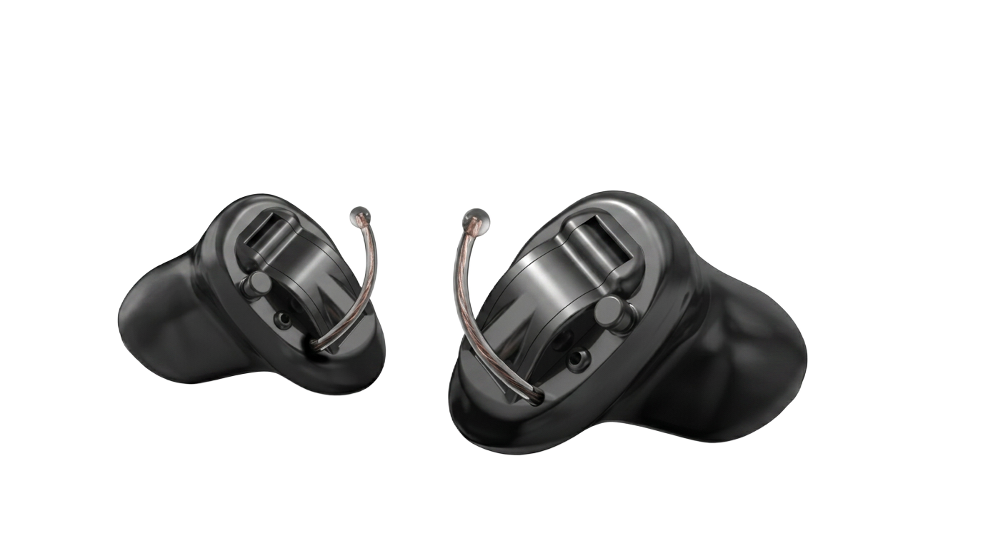 Pair of black Starkey Evolv AI custom in-the-ear hearing aids with removal wires