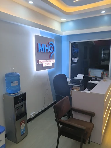 Mombasa Hearing Centre reception area with the illuminated MHC sign